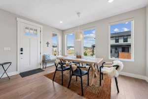Dining space featuring light wood-style floors and recessed lighting