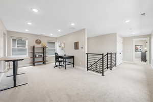 Office featuring light carpet and recessed lighting