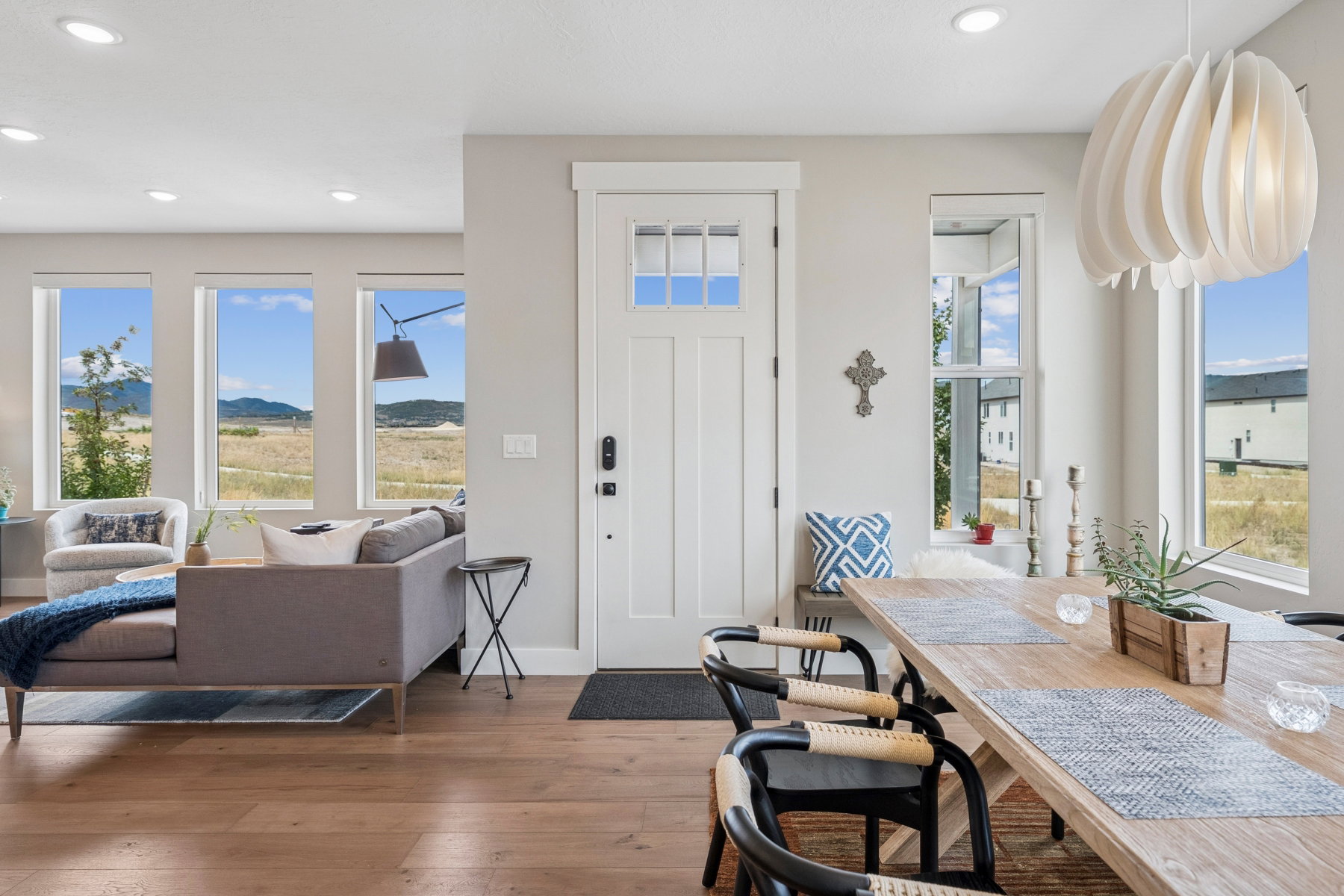 Foyer entrance with hardwood / wood-style floors, recessed lighting, a mountain view, and healthy amount of natural light