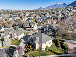 Aerial perspective of suburban area with a mountainous background