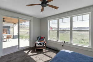Bedroom featuring a mountain view, ceiling fan, multiple windows, access to exterior, and recessed lighting