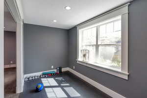 Exercise area with baseboards and recessed lighting