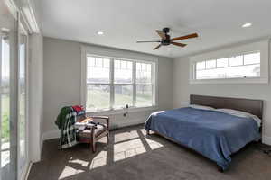 Bedroom featuring multiple windows, ceiling fan, carpet, a mountain view, and recessed lighting