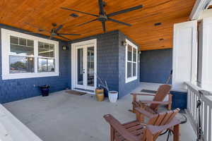 View of front patio with french doors and ceiling fan