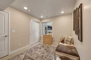 Bedroom featuring light colored carpet and recessed lighting