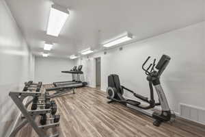 Exercise room with a textured ceiling