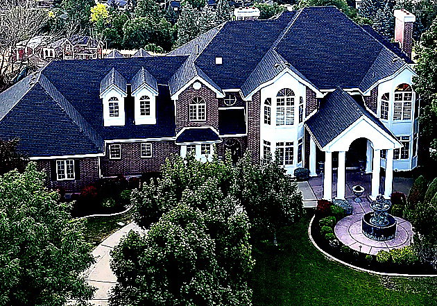 View of front of home with a front yard and a chimney