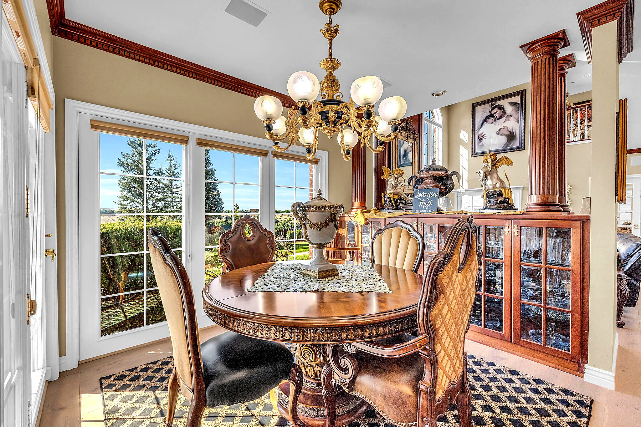 Dining room with hanging lights and baseboards