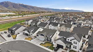 Aerial perspective of suburban area with a mountainous background