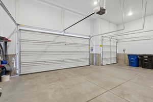 Garage featuring a garage door opener