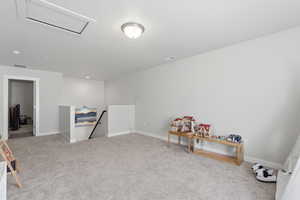 Playroom with light carpet and baseboards