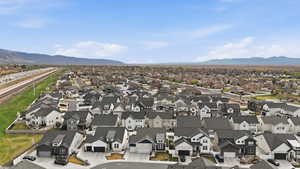 Aerial perspective of suburban area featuring a mountainous background