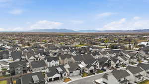 Aerial view of residential area featuring mountains