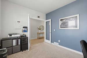 Office featuring light colored carpet and french doors