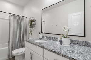 Bathroom featuring vanity and shower / tub combo
