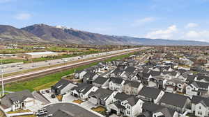 Aerial view of residential area with a major roadway and mountains