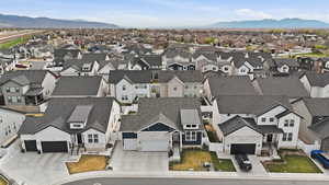 Aerial perspective of suburban area featuring a mountainous background