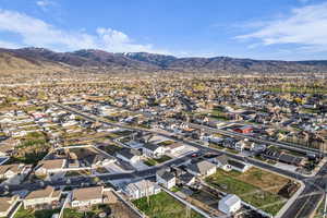 Aerial perspective of suburban area featuring a mountainous background