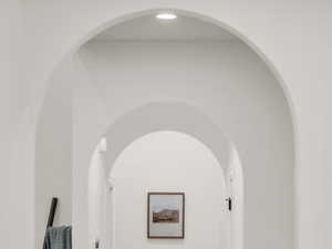 Hallway featuring baseboards