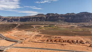 View of mountain backdrop with rural landscape and a desert landscape