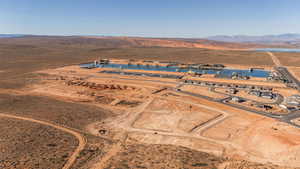 Aerial overview of property's location with a mountainous background and rural landscape