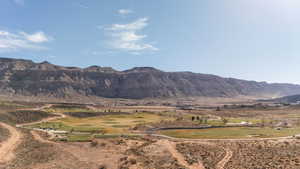 View of mountain background featuring a local golf course