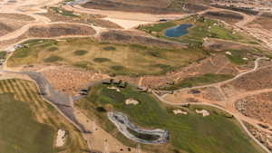 View of property location with a nearby body of water and a golf club