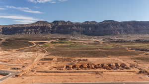 View of mountain backdrop with rural landscape and a desert landscape