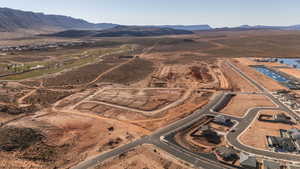 Aerial overview of property's location featuring rural landscape and a water and mountain view
