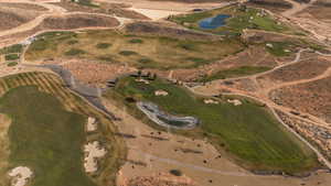 View of property location featuring a golf course and a large body of water