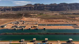View of property location featuring rural landscape and a water and mountain view