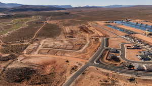 Aerial overview of property's location with rural landscape and a water and mountain view
