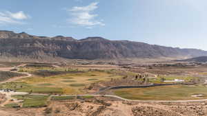 View of mountain backdrop with a golf course