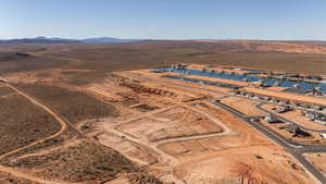 Aerial view of property and surrounding area featuring rural landscape and mountains