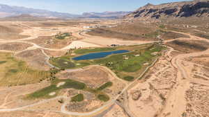 Aerial overview of property's location with rural landscape and a water and mountain view