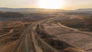 Aerial view at dusk of a mountain view and a view of rural / pastoral area