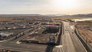 Aerial overview of property's location featuring a mountainous background
