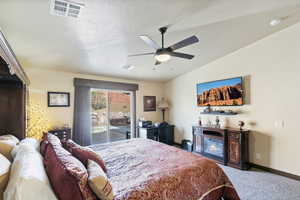Bedroom with access to outside, light carpet, and a ceiling fan