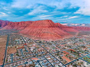 Aerial perspective of suburban area featuring a mountainous background