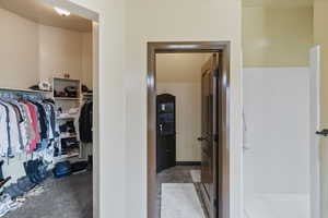 Bathroom with a walk in closet