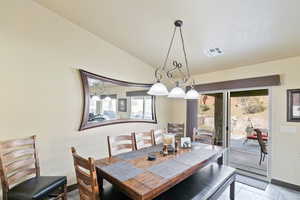 Dining space with vaulted ceiling