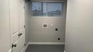 Laundry area with electric dryer hookup, hookup for a washing machine, and finished concrete floors