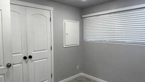 Unfurnished bedroom featuring a closet and light carpet