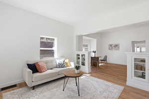 Living room featuring baseboards and light wood-style floors