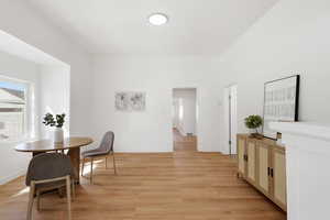 Dining area with light wood-type flooring