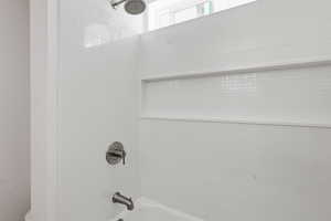 Bathroom view of shower / bath combination