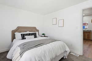 Carpeted bedroom with baseboards