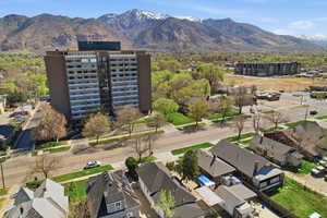 Aerial perspective of suburban area featuring a mountain backdrop