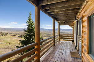 Wooden deck featuring a mountain view