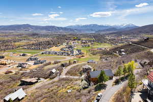 Aerial perspective of suburban area featuring a mountain backdrop